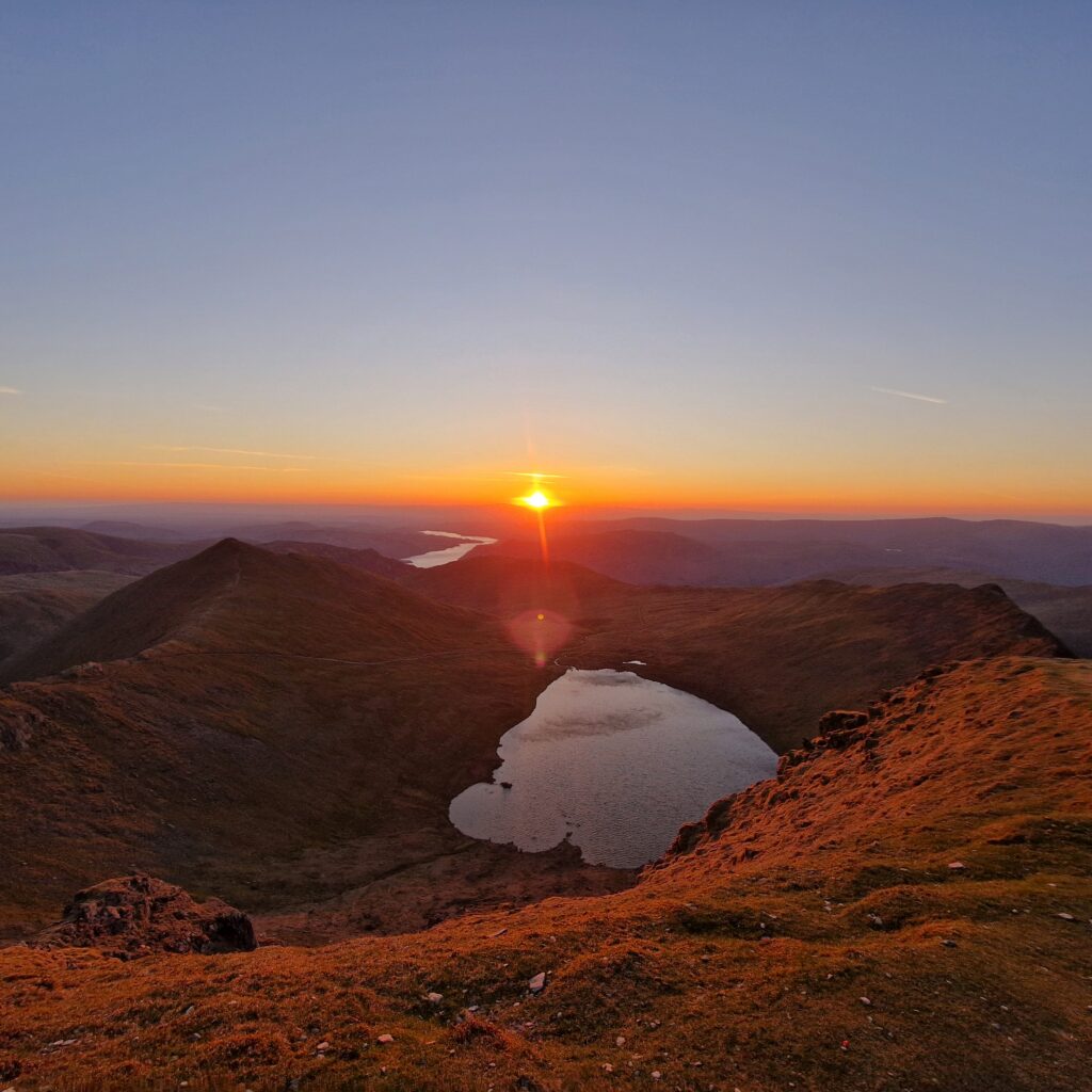A view across Thirlmere during a sunrise from Helvellyn's summit.