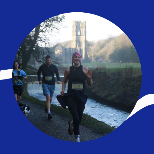 Clare runs alongside the stream at Fountains Abbey
